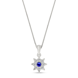 Silver necklace pendant with a blue gemstone in the center, surrounded by smaller clear stones in a floral design.