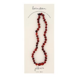 Amber-colored children's necklace, 32 cm long, with round beads in various shades of amber.