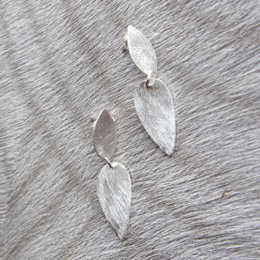 Silver stud earrings with leaf-shaped design