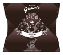 Caramel popcorn coated in dark chocolate, 30g pack. Sweet and indulgent snack.