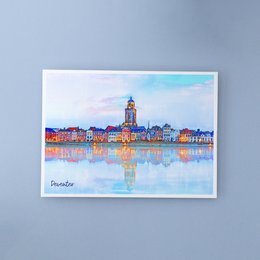 Colorful postcard depicting the Deventer skyline in the Netherlands, featuring a church tower reflected in the water.