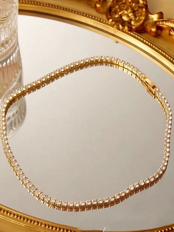 Tijdloze Rivière-chokerketting met diamantlook