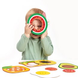 Colorful food-themed puzzle pieces with various shapes and textures, designed for children 12 months and up to develop hand-eye coordination and problem-solving skills.