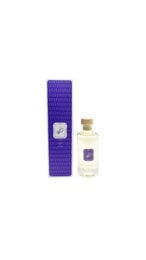 Lavender-scented reed diffuser in a glass bottle with a purple label. The diffuser features a blend of essential oils and natural reed sticks to gently fragrance a room.