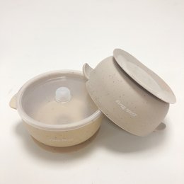 A round, speckled grey and oat-colored child's suction bowl with a lid, designed for easy feeding.