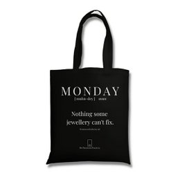 Black tote bag with the text "MONDAY (nothing some jewellery can't fix)" printed on it. The bag is made of durable material and has long handles for easy carrying.