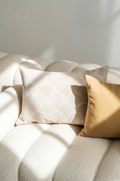 Soft, plush velour cushion cover in a neutral beige color, measuring 60x40 cm, suitable for living room or bedroom decor.