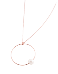 Silver necklace with circle and pearl pendant. Delicate and elegant jewelry piece.