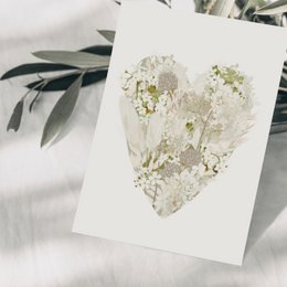 Postcard heart made of cream-colored flowers
