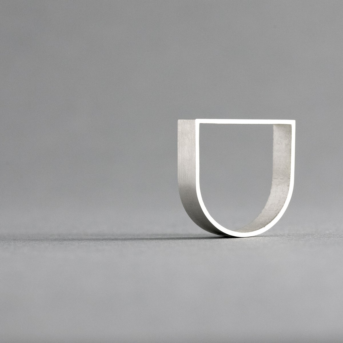 ARK Silver is a sculptural ring inspired by architecture and geometric form.