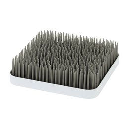 Gray silicone dish drainer with tall, flexible bristles for drying dishes and utensils.