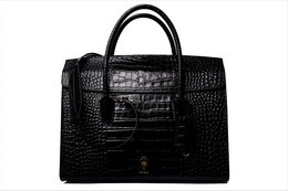 Black leather laptop bag with crocodile-embossed pattern, featuring a structured rectangular shape and a red interior lining.