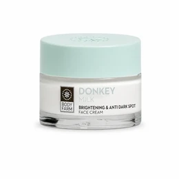 Donkey milk brightening anti dark spot face cream, 50ml jar, light mint green packaging.