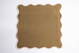 Beige linen cushion with scalloped edges, suitable for living room or bedroom decor.