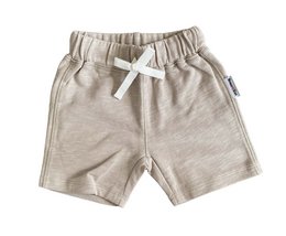 Soft, comfortable kids' pants in a neutral beige color. Made of a lightweight, breathable sweat fabric with an elastic waistband and drawstring for a customized fit. Suitable for casual everyday wear.