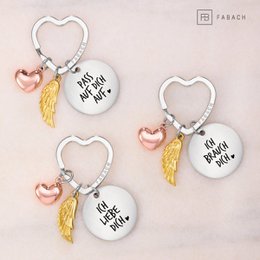 Llavero ángel de la guarda "Te amo" - amuleto de la suerte en forma de corazón con alas de ángel y placa grabada con un mensaje amoroso