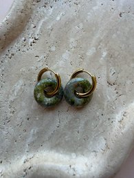 Vintage brass oval stud earrings with green patina, antique metal finish, boho style jewelry.