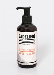 Sweet orange liquid hand soap in a black and white bottle with a pump dispenser.