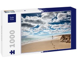 A 1000-piece puzzle depicting a scenic beach with footprints in the sand and a cloudy sky overhead. The puzzle is titled "Lais Puzzle Kap Verde Strand 1000 Teile" and is categorized as a game.