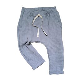 Loose fit pale blue kids sweatpants with drawstring waist. Made of soft, breathable material. Suitable for casual everyday wear.
