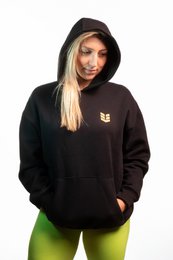  Black organic cotton and recycled polyester hoodie with Venus Hoody branding. Relaxed fit, long sleeves, and ribbed cuffs and hem.