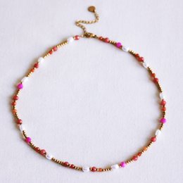 Collana con perle e sfaccettature - corallo/arancio/rosa