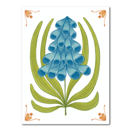 Decorative tile with a blue flower and orange details. The tile features a stylized floral design with green leaves and blue petals or blooms.