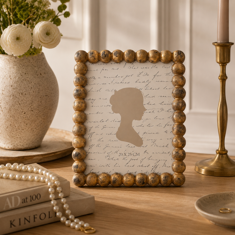 Decorative photo frame in gold resin spheres 24x19 cm