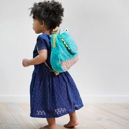 Teal and navy blue backpack with a crocodile design, suitable for kids.