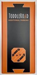 Miniature parking lot toy with road markings and parking spaces.