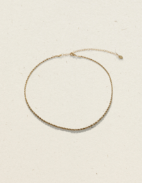 Gold-toned twisted chain charm bracelet with clasp closure.