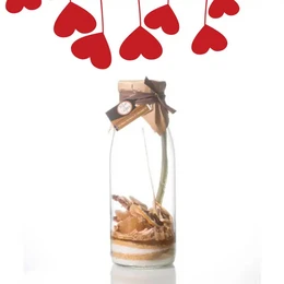 A glass jar containing a layered dessert with lemon slices, ginger, and other ingredients, surrounded by red heart-shaped decorations.