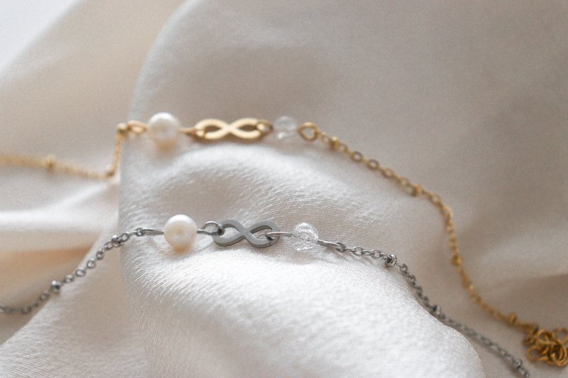 Infinity & Parel Armband - Goud