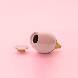 Pink ceramic round ecological sprinkler planter with brass spout, modern minimalist design for plants