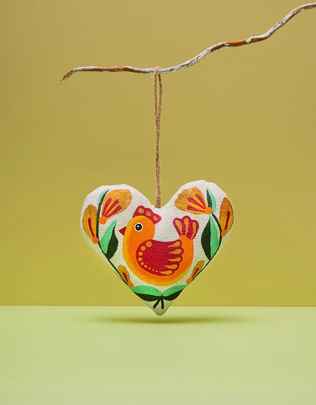 Cuore di vaniglia con uccellino arancione