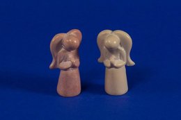 Small natural soapstone angel statues with detailed features and a simple, elegant design.