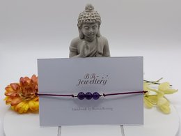 Amethyst gemstone bracelet with a variety of metal finishes including silver, gold, and rose gold. The bracelet features a delicate and elegant design.
