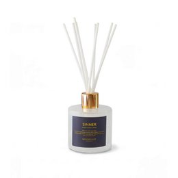 White cylindrical scented candle with gold lid, blue label, luxury home fragrance, aromatic decor.