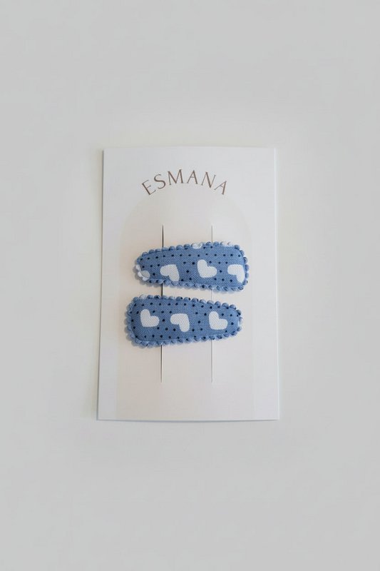 Fermagli per capelli blu con cuori bianchi