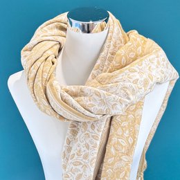  Floral patterned scarf made from a mix of yak wool, featuring shades of green and gold.