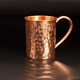 Hammered copper cocktail mug with a capacity of 400 ml. The mug has a unique textured surface and a copper finish, making it a stylish addition to any bar or home.