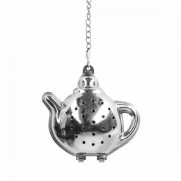 Stainless steel tea strainer in the shape of a teapot, with perforated holes for steeping tea leaves.