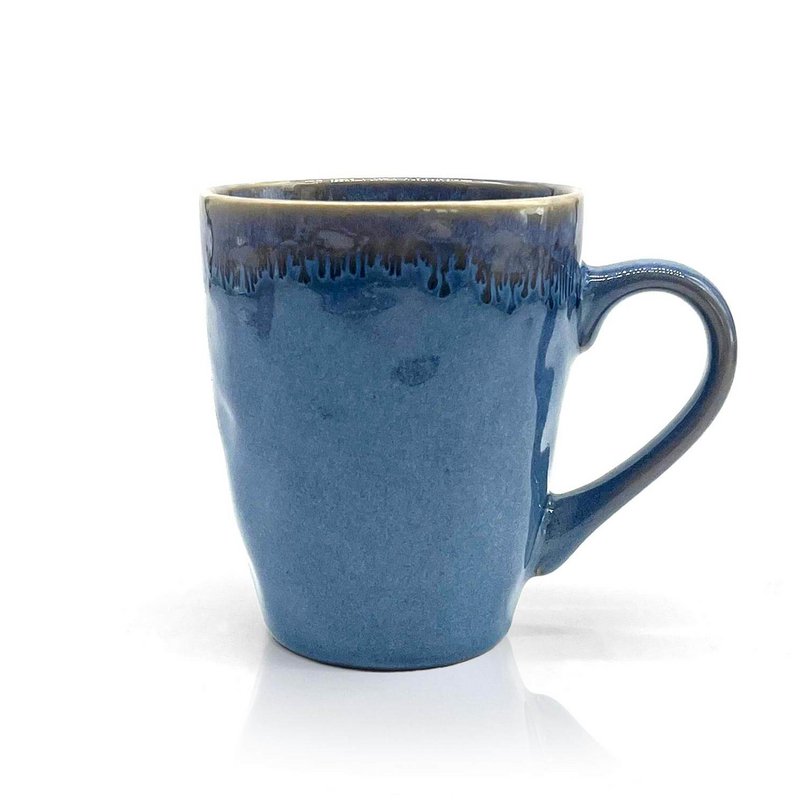 Stoneware mug with blue handle