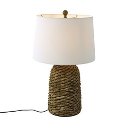 Rattan woven base table lamp, white linen cylindrical shade, natural woven texture, coastal style lighting fixture.