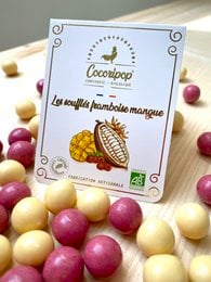 Raspberry mango soufflés, a delightful chocolate-covered fruit treat with a sweet and tangy flavor profile.