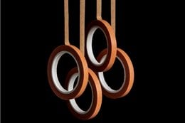Set of thin, orange washi tapes with circular and linear shapes.
