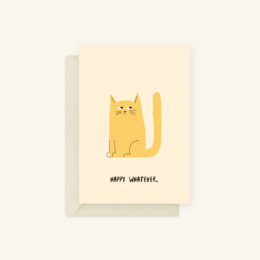 Eco-friendly greeting card with a cute yellow cat illustration and the text "Happy whatever." The card is made of recycled materials and is suitable for birthday celebrations.