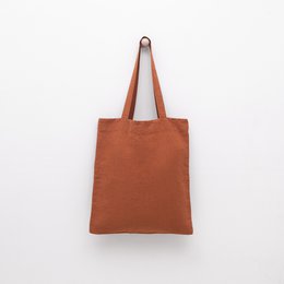  Baked clay linen tote bag, a stylish and durable shopping bag made of natural materials in a warm, earthy tone.