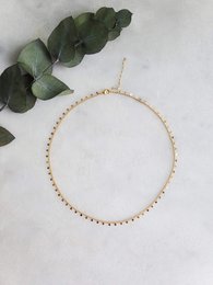 Delicate gold-toned chain necklace with a simple, elegant design. Suitable for everyday wear or to complement a variety of outfits.