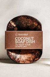 Coconut shell soap dish with natural texture and organic design, suitable for bathroom or kitchen use.